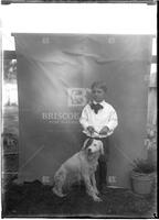 Child (boy) with dog