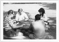 Photograph of Daniel "Dan" Lewis (back left), Charlene Hutton, Harry Joiner (front left), and unid