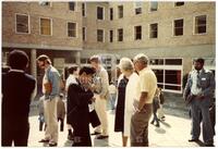 Photograph of Walter and Mary Rudin with Finbarr Holland and other attendees of the NATO Advanced Study Institute, July 1984