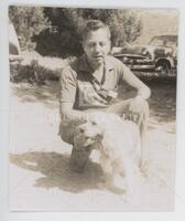 Photograph of John L. Kelley with dog