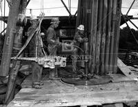 Men and drilling rig, no. 4488; Oil