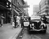 1936 Ford V-8 car on street; Autos