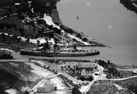 Aerial of San Jacinto Inn and battleship; Monuments and memorials-San Jacinto Centennial and founders' cemetery
