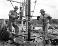 Two roughnecks working; Oil