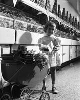 Little girl in produce market, no. 10420; Grocery stores