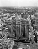 Aerial of Rice Hotel with M & M building, water towers, no. 01651; 1999 calendar back negatives