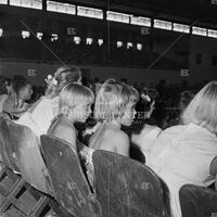 Photograph of children attending performance by Elvis Presley