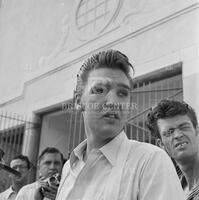 Photograph of Elvis Presley meeting fans