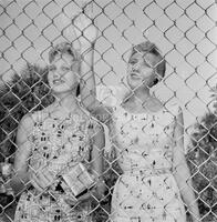 Photograph of two women attending Elvis Presley performance