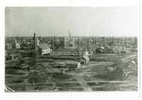 Corsicana [neighborhood full of oil derricks], about 1900