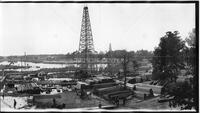 Panorama of construction and oil derricks in river basin