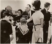 Gonzalez and presidential party being met at the airport