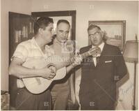 Henry B. Gonzalez being serenaded, signed.