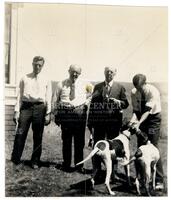 Lomax family men with dogs