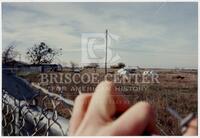 Timothy McVeigh’s hand over fence looking over someone’s land.