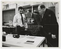 Athelstan Spilhaus and two other men inspecting documents