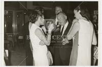 Athelstan Spilhaus conversing with two women