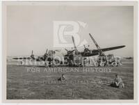 Photograph of U.S. B-24 bomber getting serviced