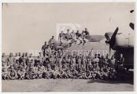 Photograph of U.S. Army Air Corps crew in front of "Strawberry Bitch" bomber plane