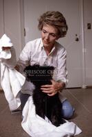 Nancy Reagan bathing dog in sink [T 52735]