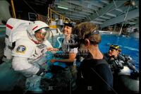 Astronaut prepares to go underwater