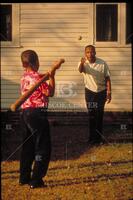 Dr. Martin Luther King, Jr. playing baseball with his son