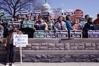 Candlelight vigil, anti-abortion demonstrators on steps of Capitol during pro-life demonstration [C 001534]