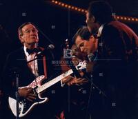 President George H. W. Bush plays guitar