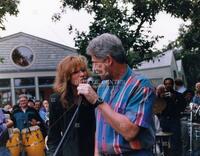 President Bill Clinton sings a duet with entertainer Carly Simon
