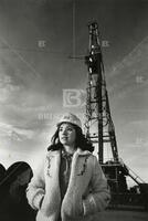 [Young woman in oil field]