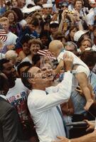 [President Bush holding baby]