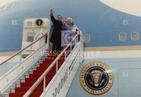 [President and First Lady Bush boarding plane]