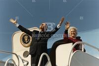 [President and First Lady Bush boarding plane]