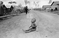 [Cambodian refugee child on the road outside Thai camp]