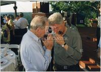 Bernard Rapoport talking with Bill Clinton