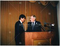 Rod Blagojevich and Bernard Rapoport at podium in the Drake Hotel, Chicago