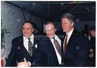 Unidentified man, Bernard Rapoport, and Bill Clinton