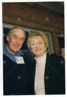 Bernard Rapoport and woman posing at reception