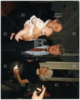 Audre Rapoport, Ted Kennedy, and Bernard Rapoport holding baby