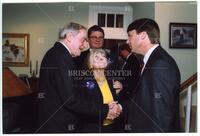 Bernard Rapoport shaking hands with John Edwards