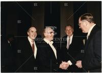 Bernard Rapoport, Jim Wright, and two unidentified men greet each other
