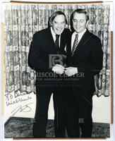 Bernard Rapoport and Walter Mondale shaking hands