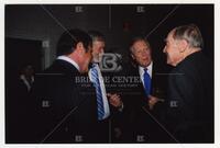 Bernard Rapoport speaking with Roger Smith, unidentified man, and Dick Gephardt