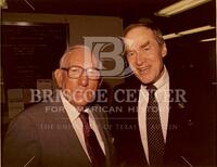 Photograph of Bernard Rapoport wearing Mondale campaign pin with unidentified man