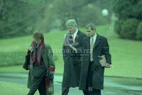 President Bill Clinton with white house staffers Bruce Lindsey and Evelyn Lieberman