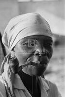 Haitian woman smoking a pipe