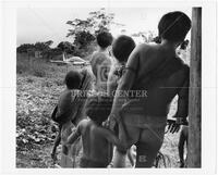 Amazonian family looking at airplane