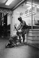 National Guardsman gets boots shined in Detroit