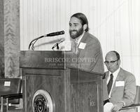 Dr. Ralph Krause of the National Science Foundation at the microphone, seated at the rear is President S. H. Spurr of the University of Texas at Austin. (14)