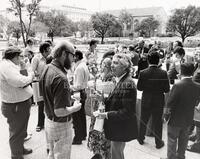 Professor J. L. Kelly from University of California at Berkeley talking with Professor Klaus Bichteler in the foreground. (30)